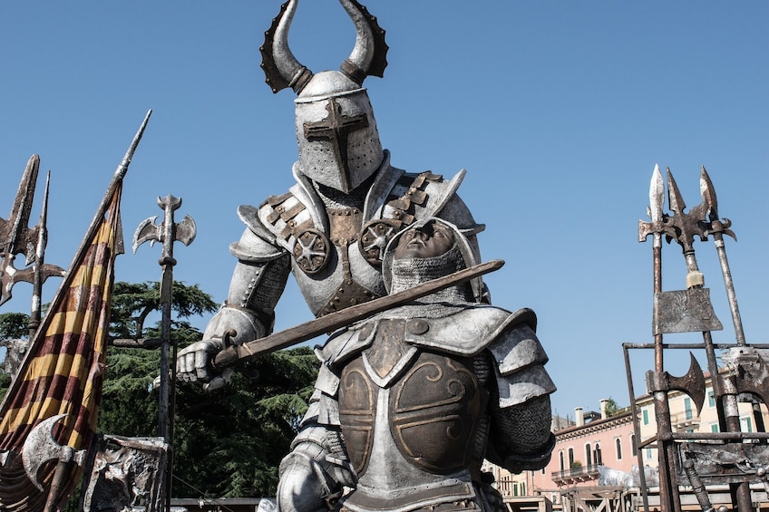 Two suits of armor set to look like they are fighting in Italy