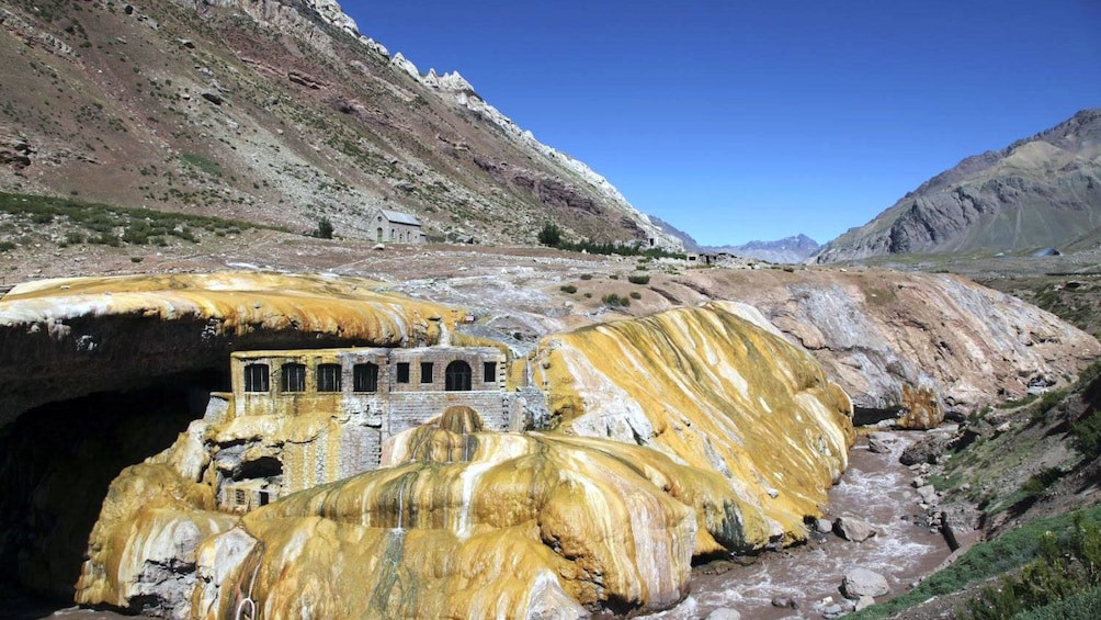 Remains of a building in a valley of the Andes mountain range