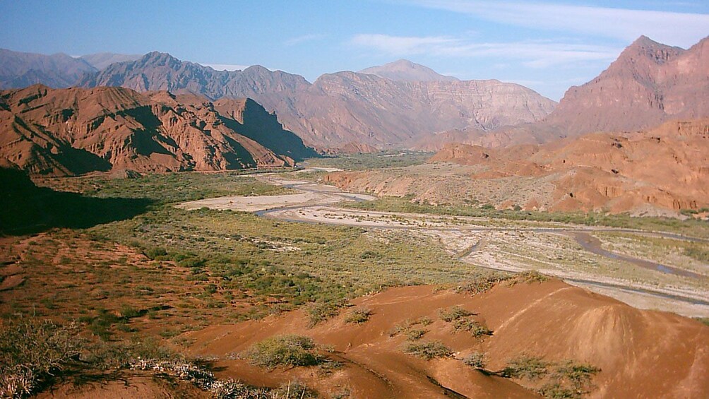 Green CalchaquĆ Valley surrounded by mountains in Argentina