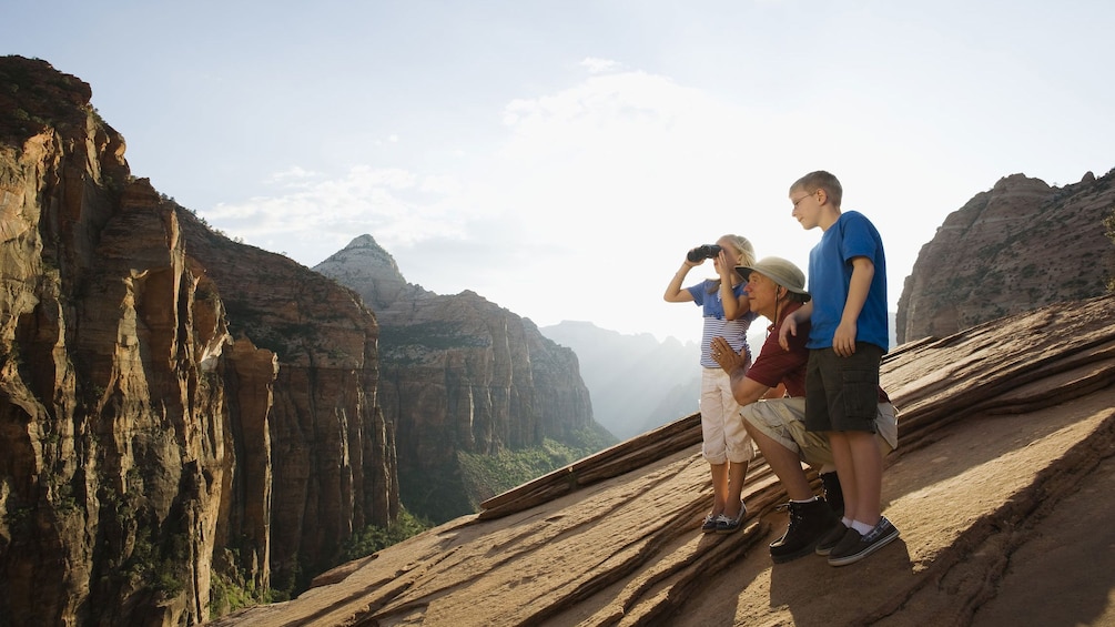 Father with his young son and daughter enjoying the views within Zion National Park