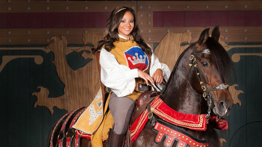 Show item 4 of 6. Heroine on horseback at the tournament of kings dinner show in Las Vegas