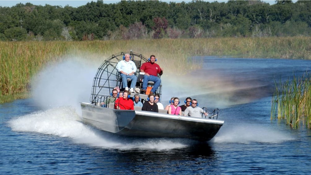 air boats sailing down lake in New Orleans