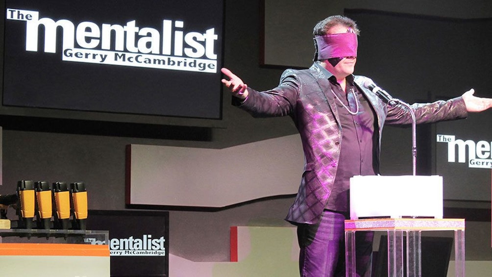 Gerry McCambridge standing on stage with a blind fold on at The Mentalist show in Las Vegas