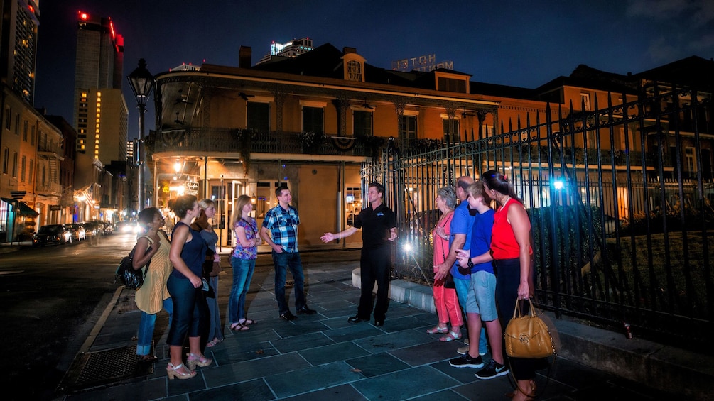 tour guide speaking to tourist at ghost tour in New Orleans
