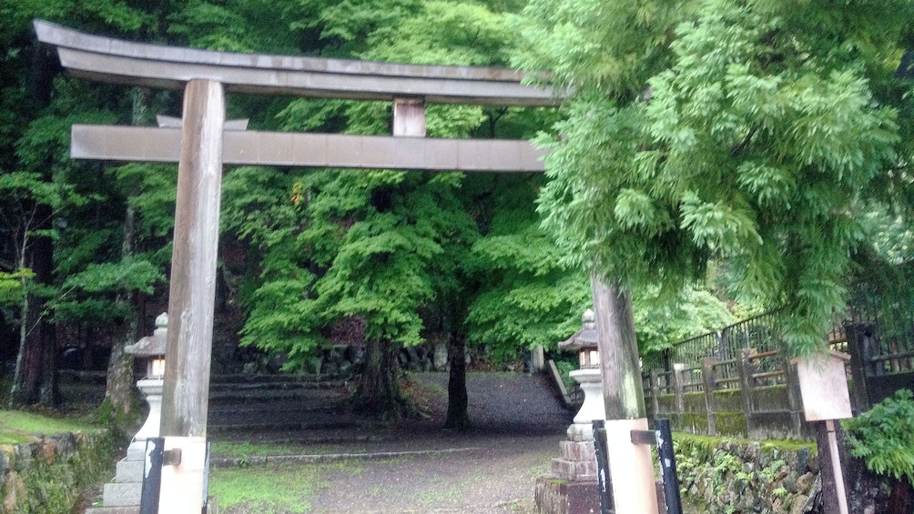Show item 3 of 5. A torii gate at the entrance to a temple in Kyoto