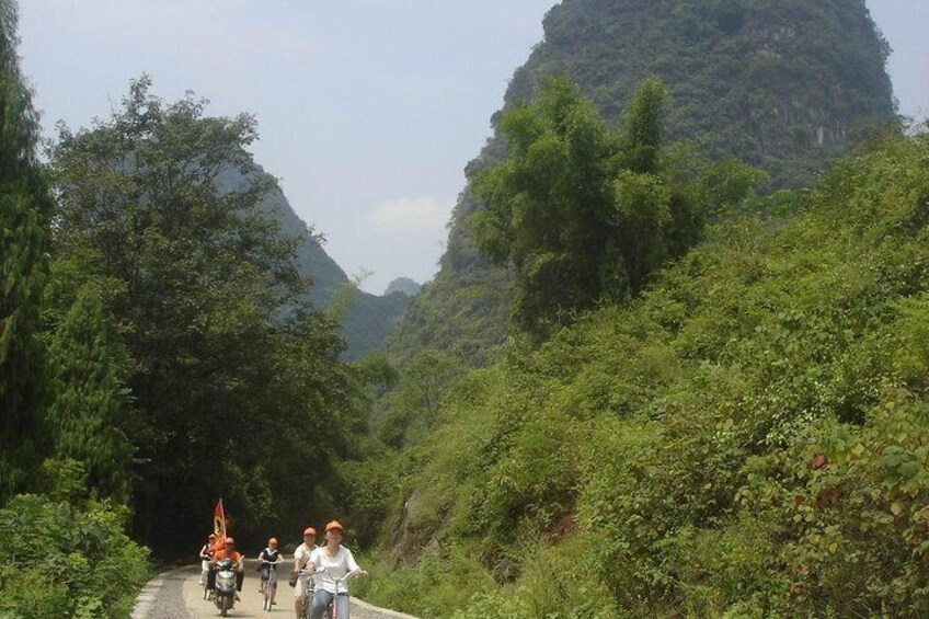 Biking is just one way you'll experience Yangshuo and Guilin on this overnight tour. 