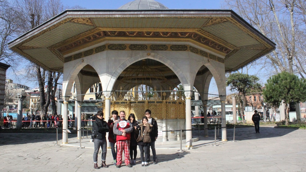 Tourist group stands for a picture in front of a building in Istanbul
