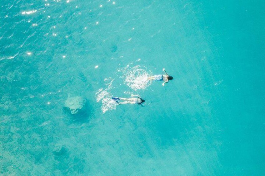 swim in a crystal clear water