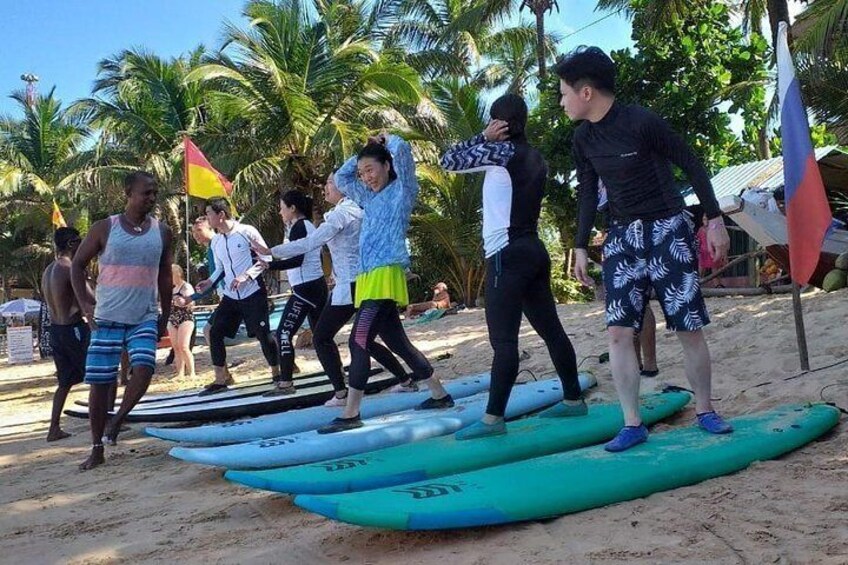 Surf lessons session for visitors from China which is conducted by our instructors at Hikkaduwa beach, Sri Lanka