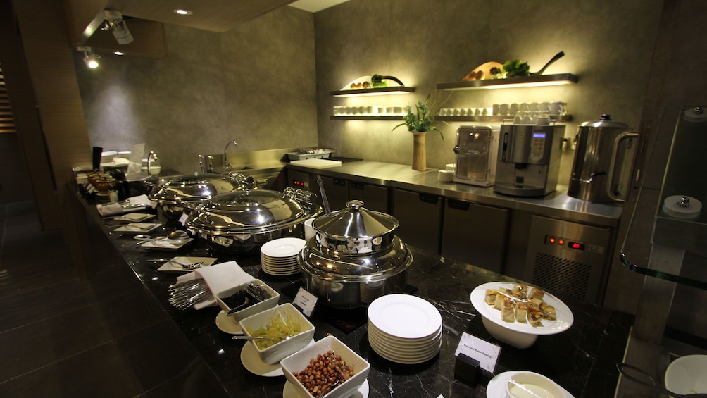 Self serving buffet area at the Penang International Airport Lounge in Malaysia