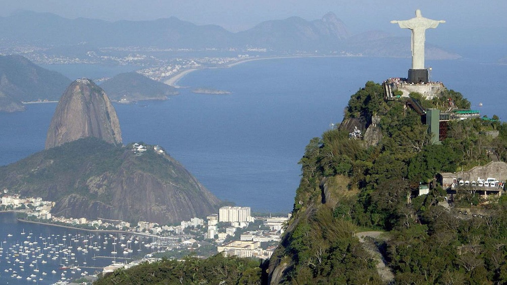 Christ the Redeemer looking down on Sugarloaf Mountain and Rio de Janeiro