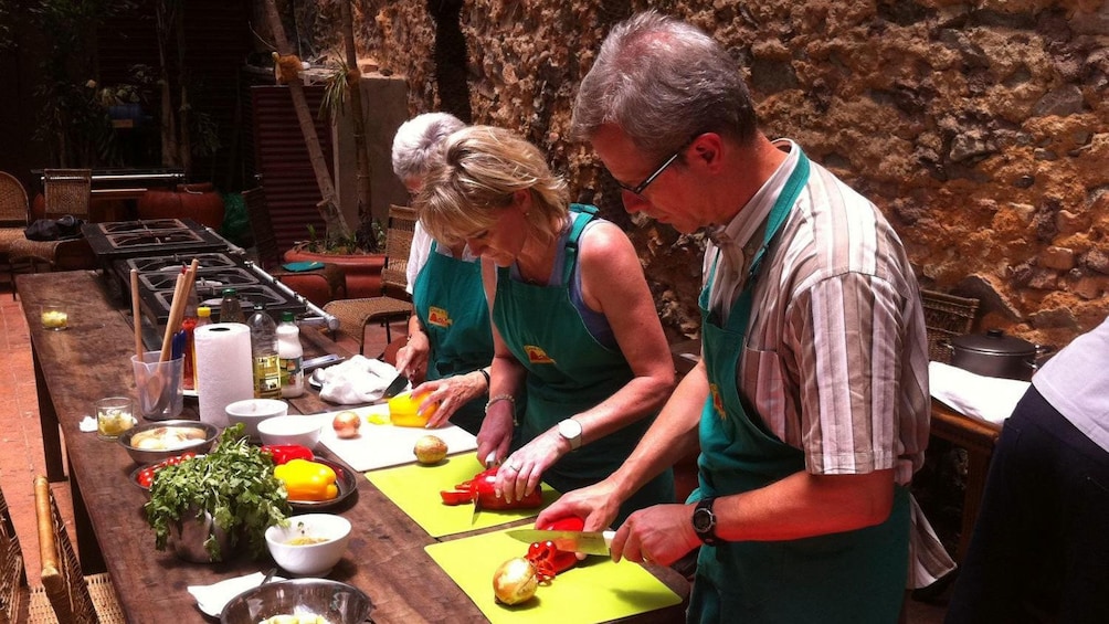 Cooking class chopping vegetables