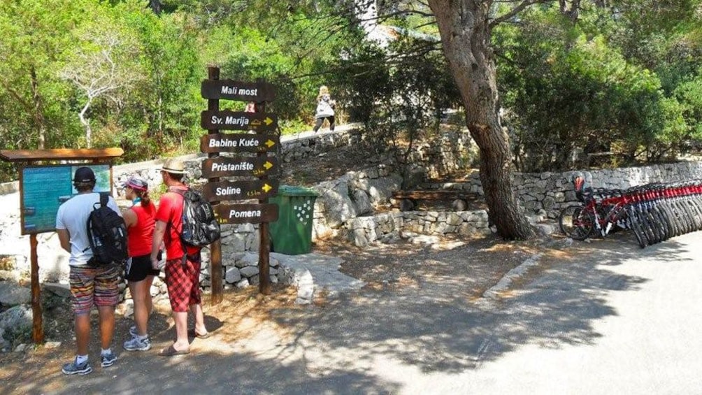 Travelers navigating old trails at Mljet island
