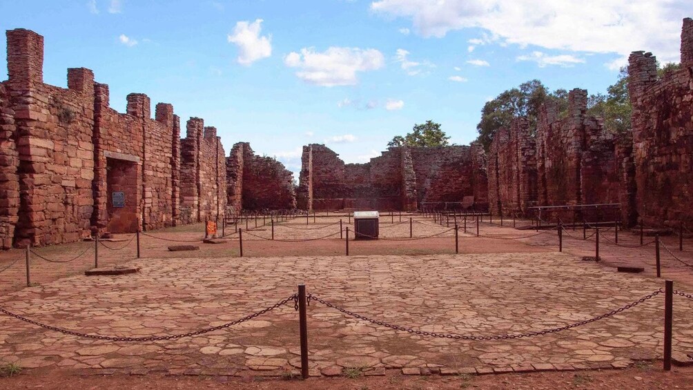 Paved open space surrounded by rock walls in Iguazu