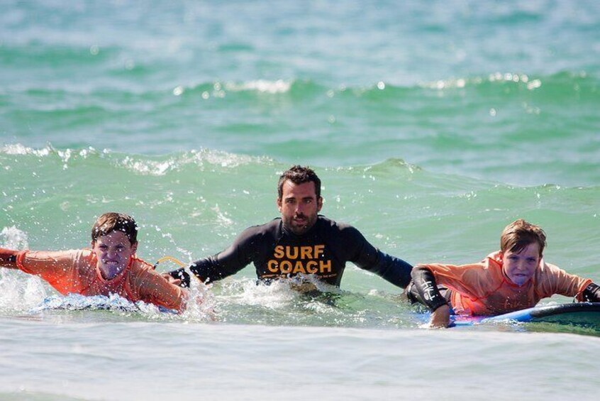 Catching waves at Fistral beach.