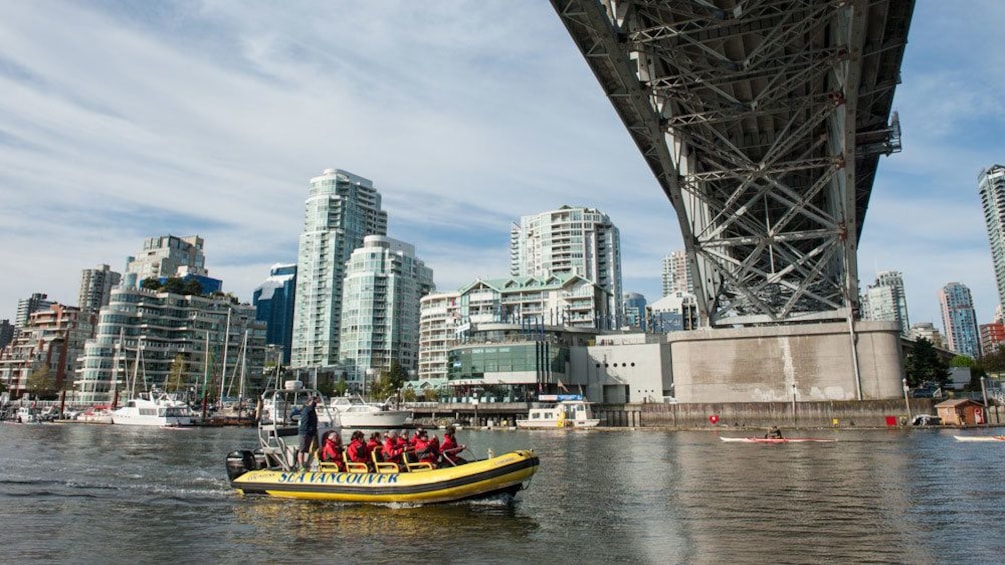 Raft going beneath a bridge in Vancouver