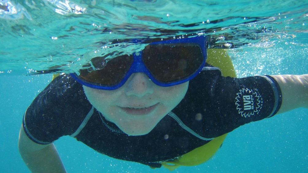 Child snorkeling in the Caribbean