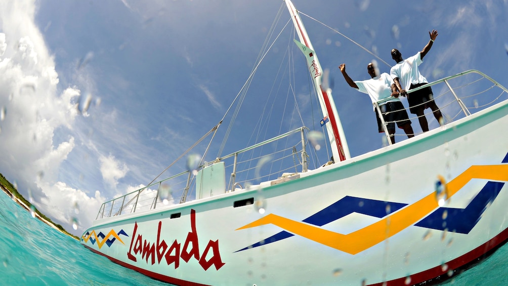 Passengers aboard the Lambada catamaran on a hot, sunny day