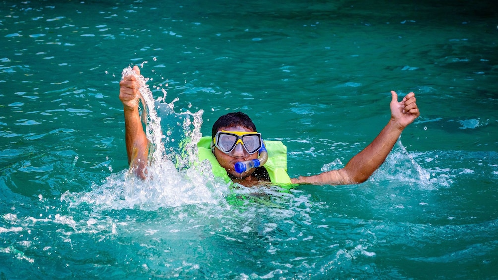 Young man snorkeling in Malgrats Island