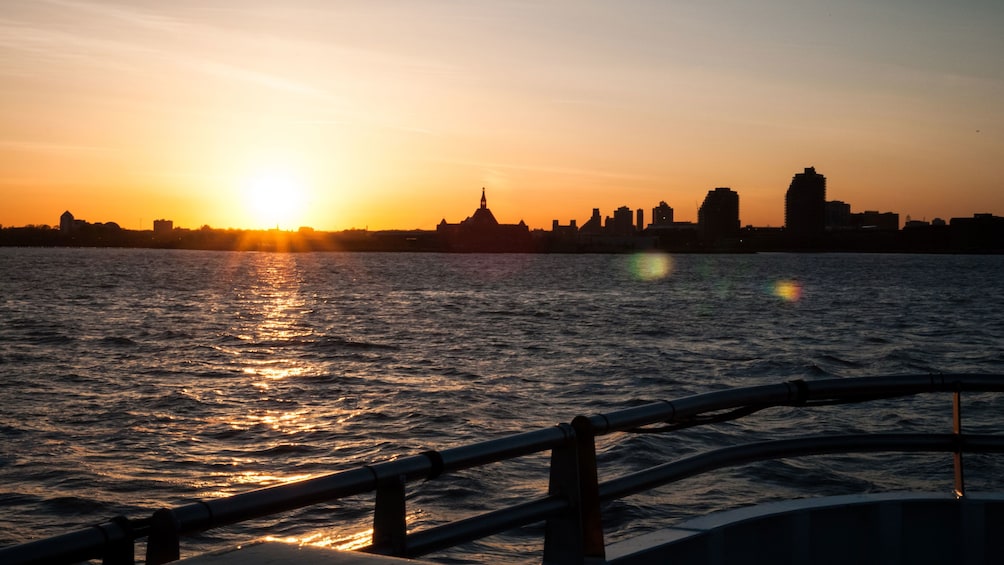 Skyline of the city at sunset from the deck of a boat in New York