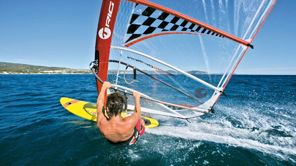 Windsurfer making a sharp turn in Brisbane