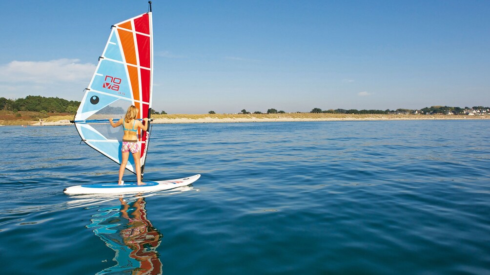 Woman learning how to windsurf in Brisbane
