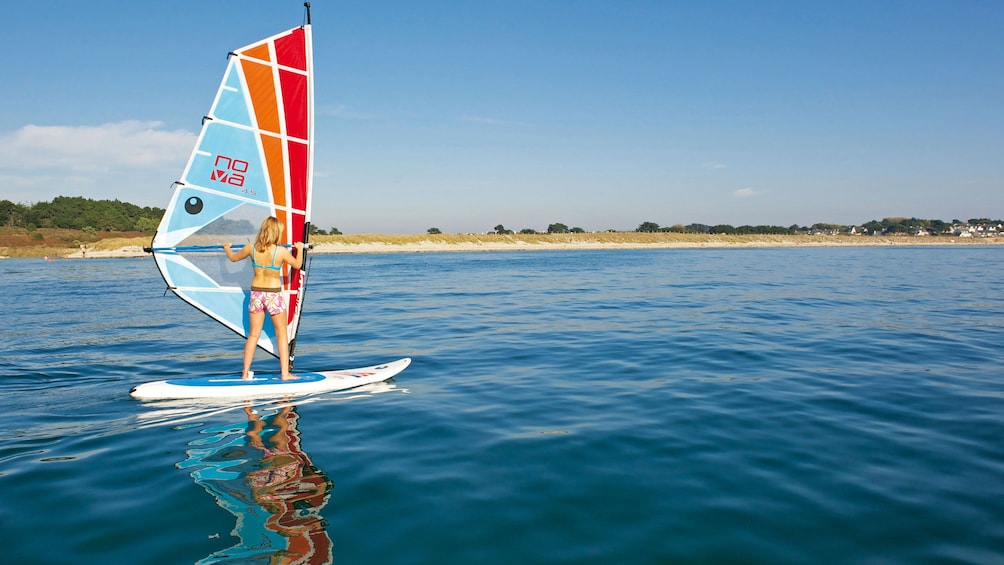 Woman learning how to windsurf in Brisbane