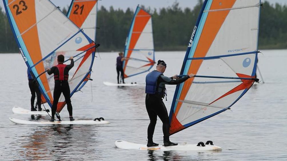 Group learning how to windsurf in Brisbane