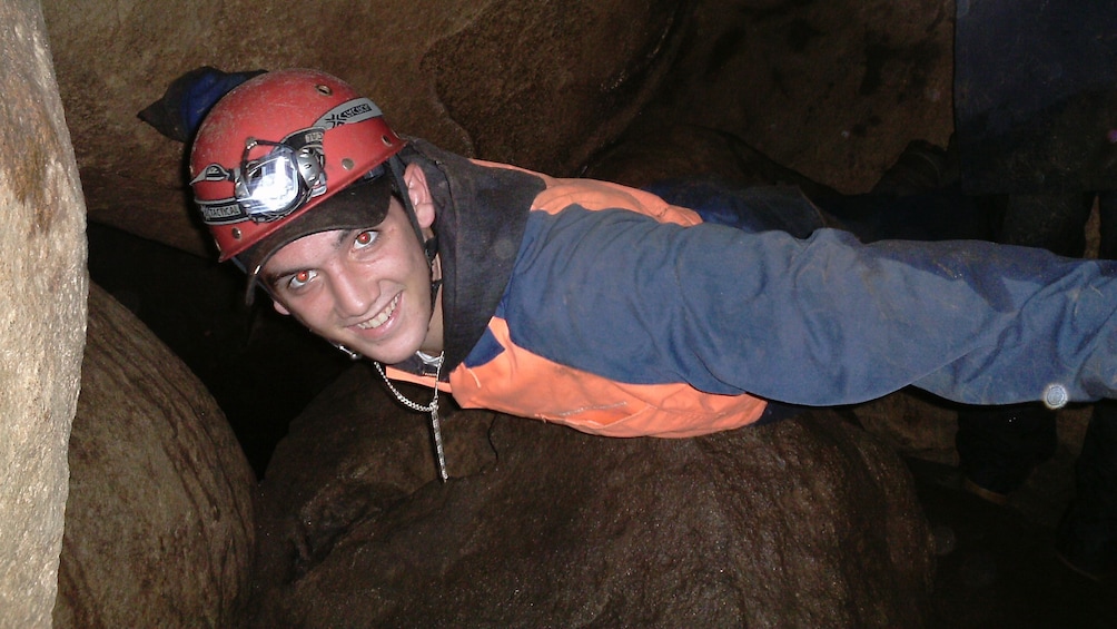 happy man exploring cave in Melbourne