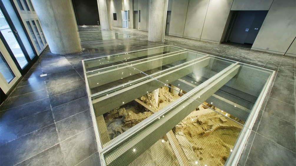 Underground ruins seen through the floor at the Acropolis Museum in Athens