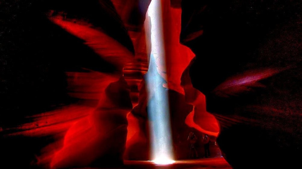 Sun peeks through the ceiling of the slot canyons of Antelope Canyon