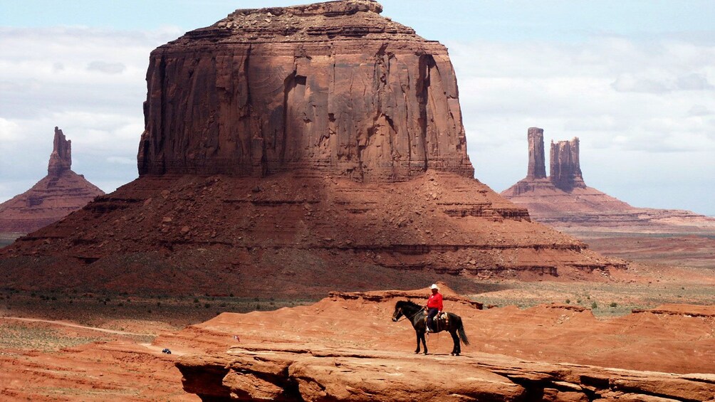Cowboy traversing the landscape of Monument Valley Tribal Park