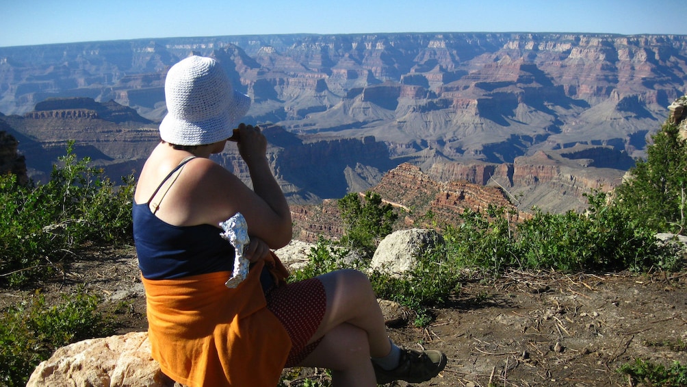 Woman enjoying the majestic view of the Grand Canyon