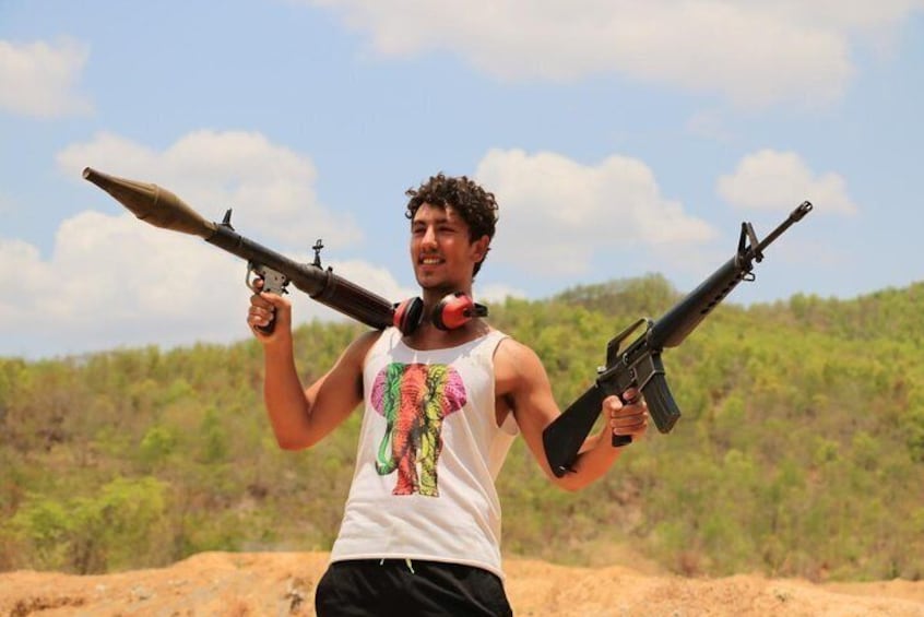 two hands two guns AK47 RPG Rocket launcher Cambodia shooting Range