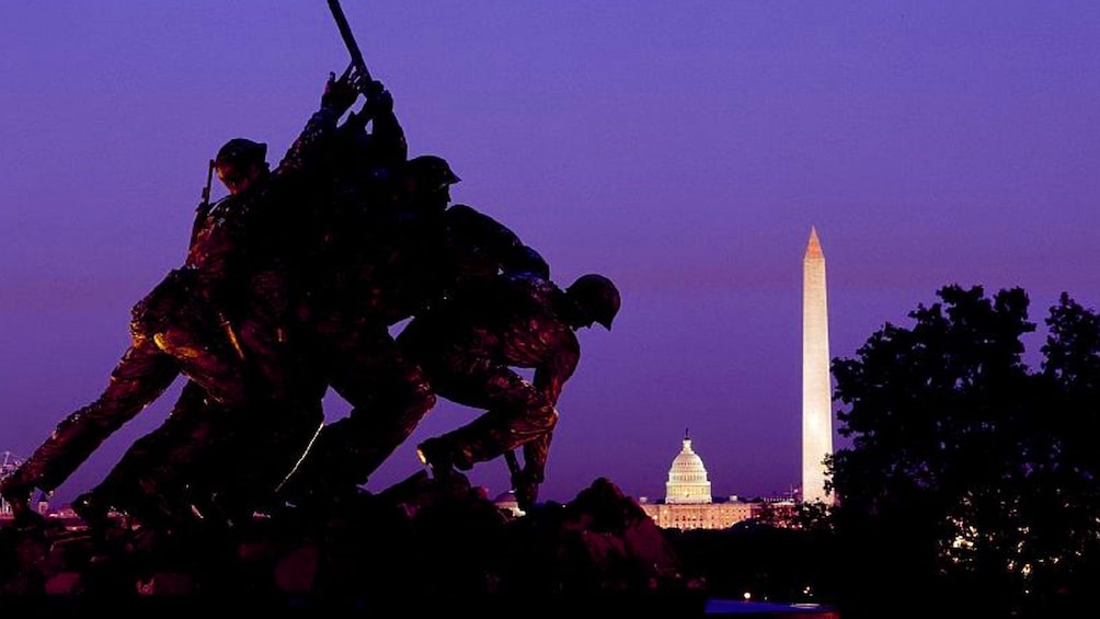 Statue to Iwo Jima next to a small Capital building and Washington Monument