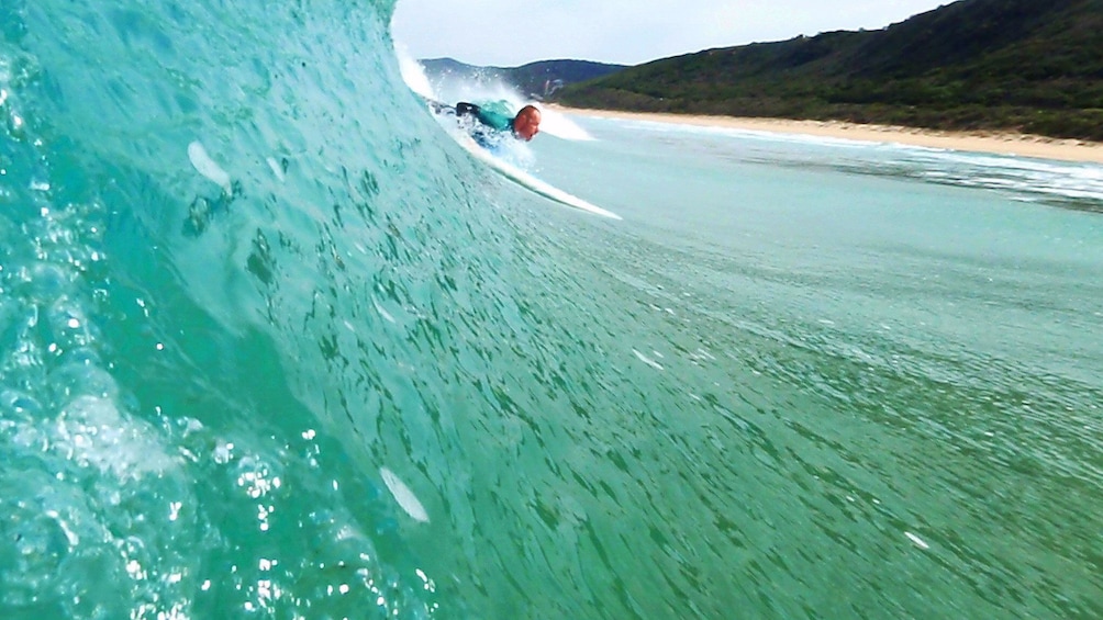 Show item 3 of 5. Body boarder in the wave on the Great Ocean Road Surf Lesson in Australia