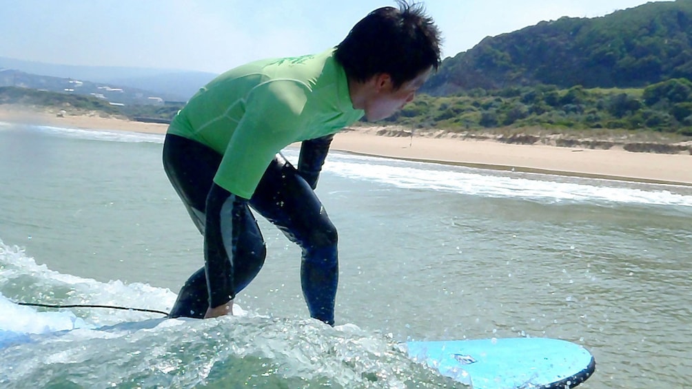 Show item 2 of 5. Surfer riding wave to shore on the Great Ocean Road Surf Lesson in Australia