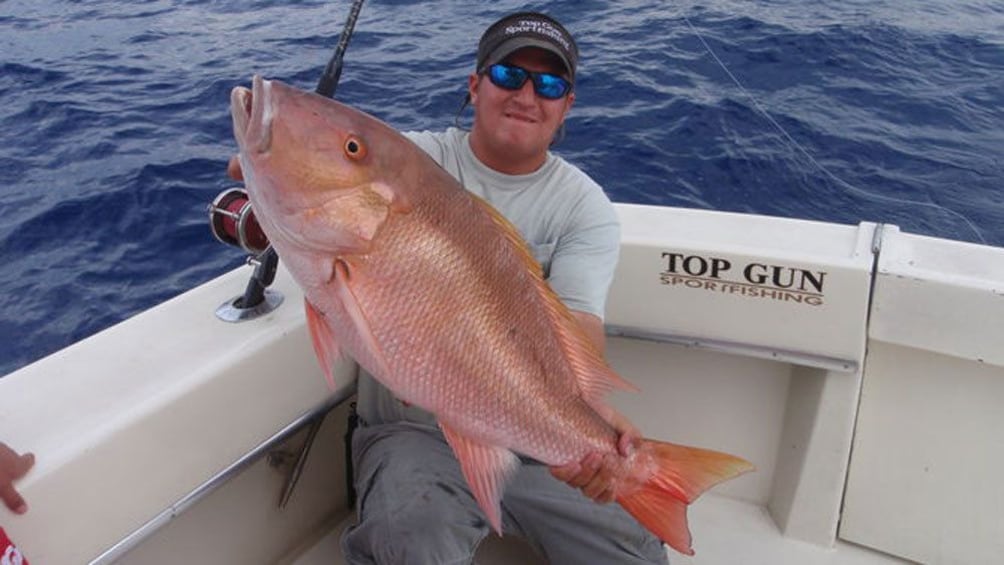 Displaying the catch of the day aboard the Top Gun in Key West