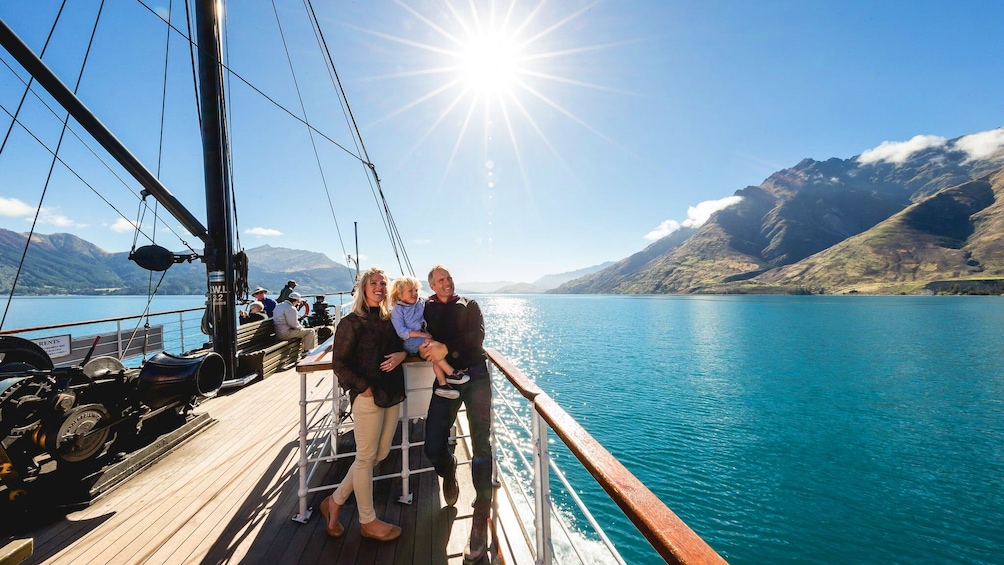 Family on a boat in the water off of Queenstown