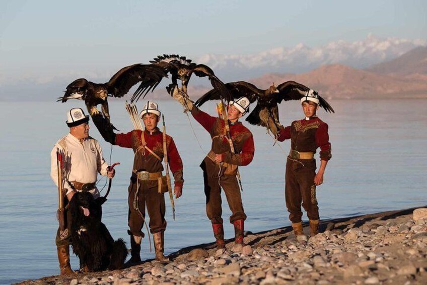 Eagle hunters in the shore of the Yssyk-Kyl lake