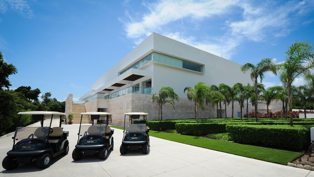 Golf carts in front of Riviera Maya Golf Club