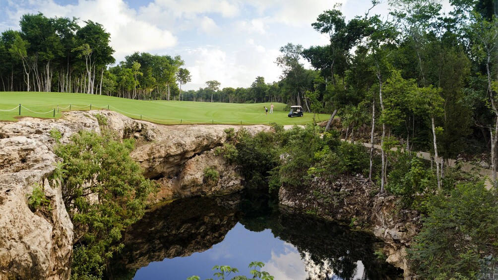 Water trap and greens at Riviera Maya Golf Club