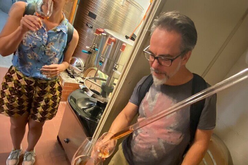 Enjoying wine straight from the barrel