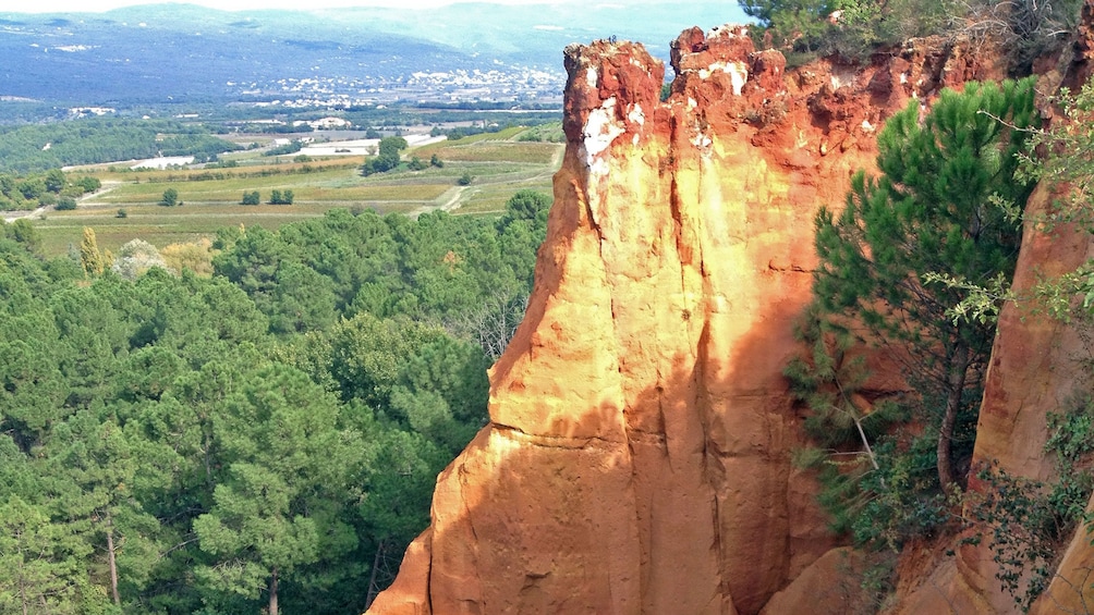 Show item 1 of 5. Red cliffs near the city of Roussillon