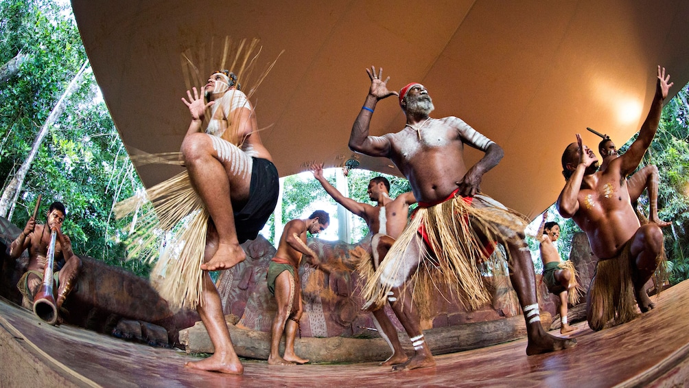 group of aboriginals perform a native dance in Cairns