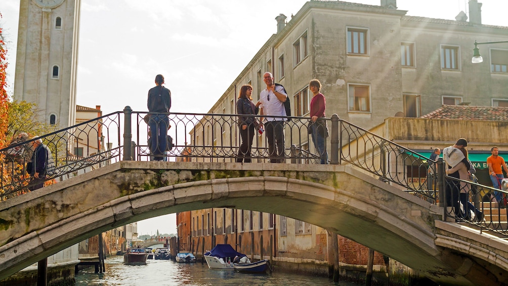 People on a bridge in Venice Italy 