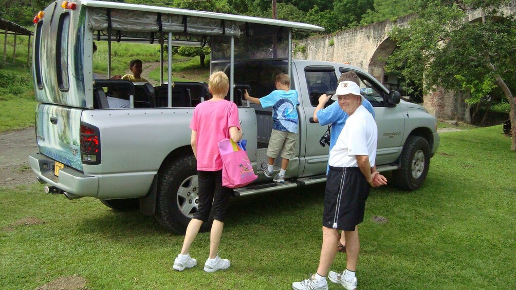 Tour group boarding a truck in St Kitts