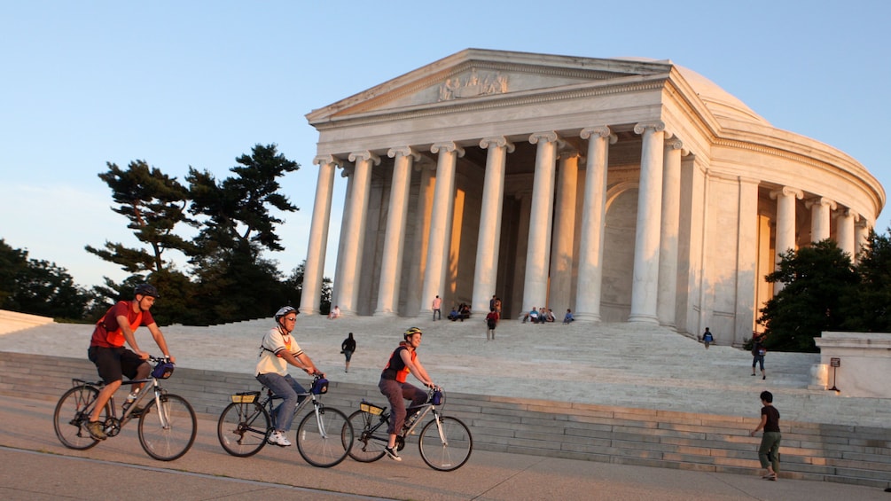 Show item 1 of 5. Bikers riding along the Jefferson Memorial in Washington DC