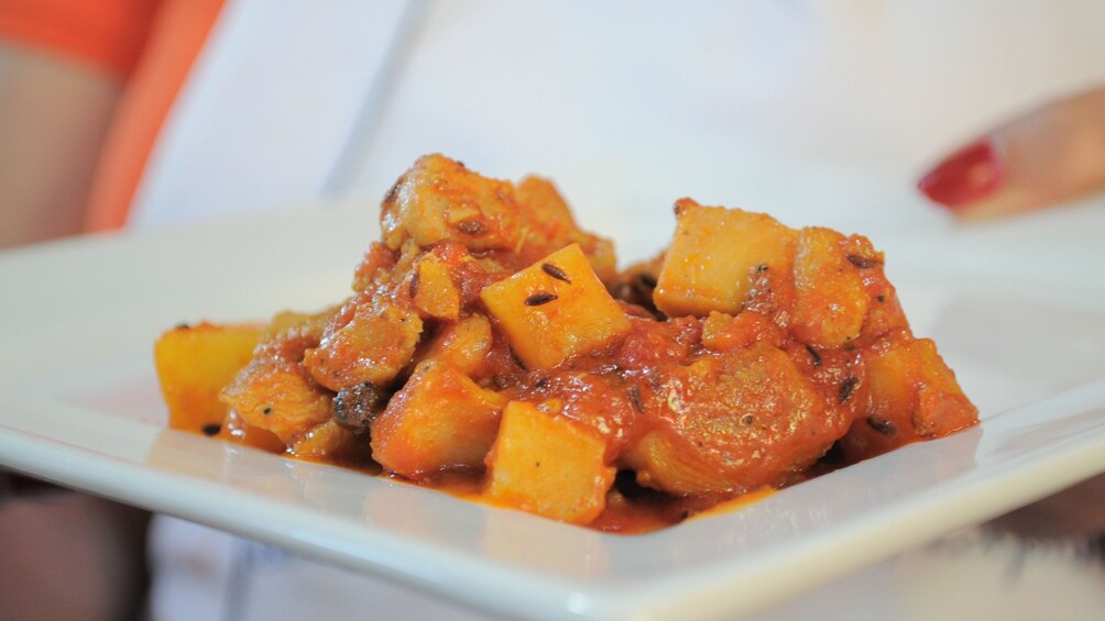 a plate of Indian curry and vegetable at cooking class in Melbourne
