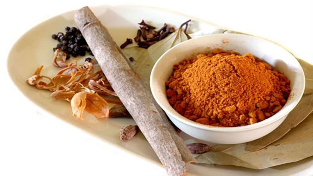 mortar and pestle  with groud curry at Sri Lankan Cooking tour in Melbourne